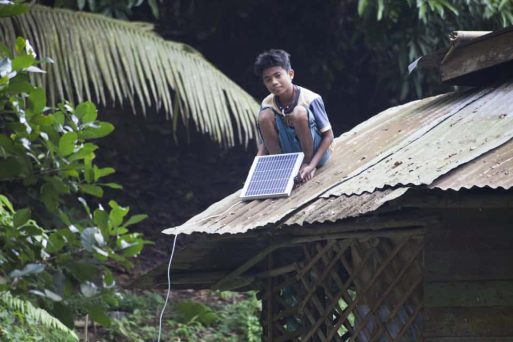 boy-showing-solar-panel-on-roof